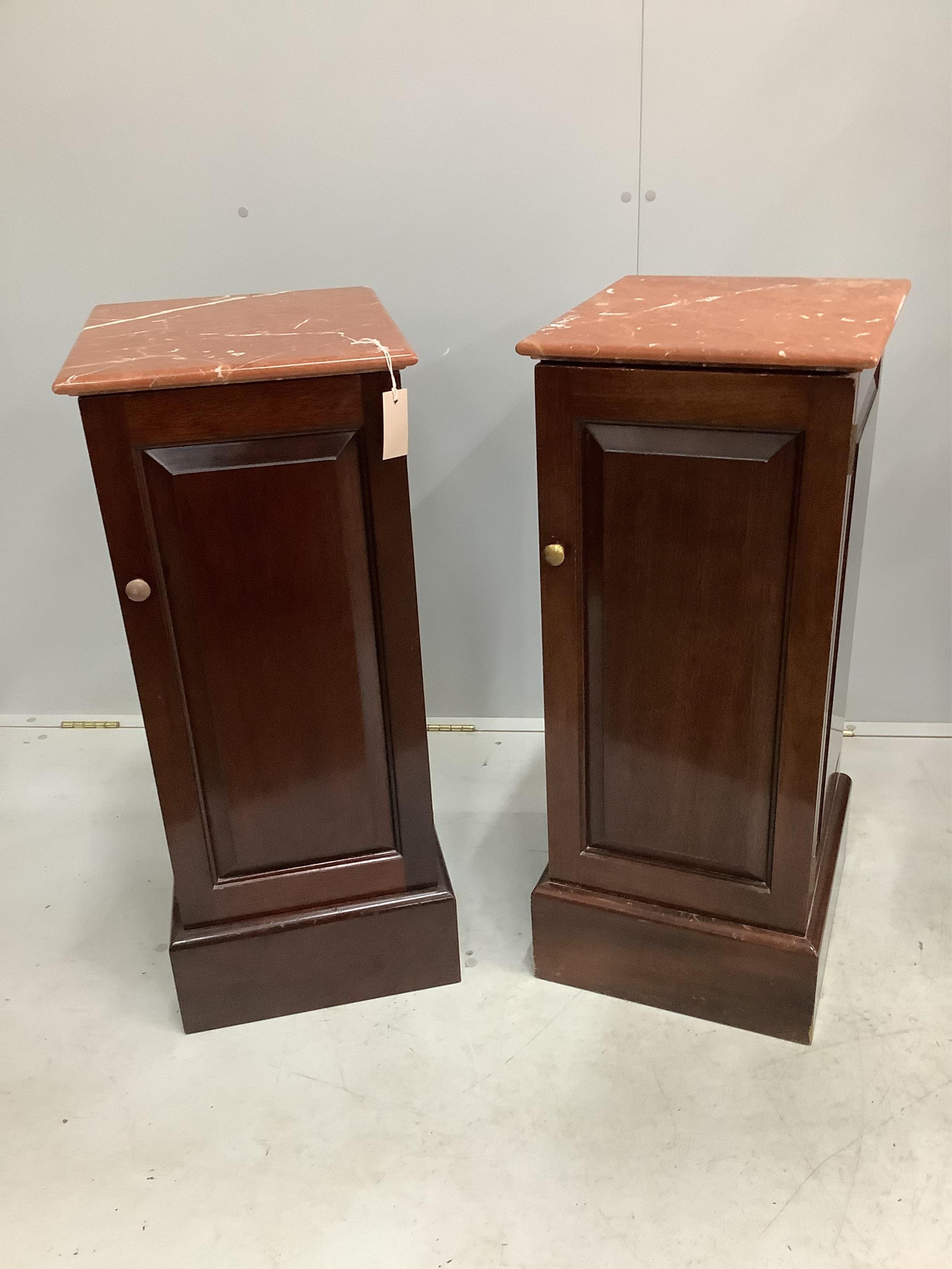 A pair of modern marble top mahogany bedside cupboards, width 36cm, height 85cm. Condition - good